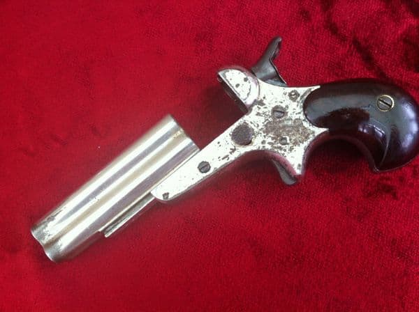 X X X  SOLD X X X  A Rare 4 brld Sharps rimfire Derringer, nickel plated, Bird's head grip. Obsolete