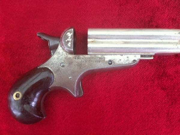 X X X  SOLD X X X  A Rare 4 brld Sharps rimfire Derringer, nickel plated, Bird's head grip. Obsolete
