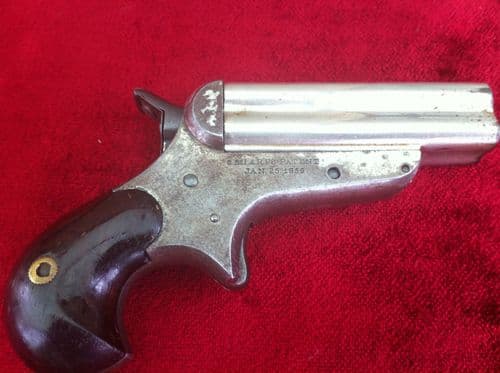 X X X  SOLD X X X  A Rare 4 brld Sharps rimfire Derringer, nickel plated, Bird's head grip. Obsolete