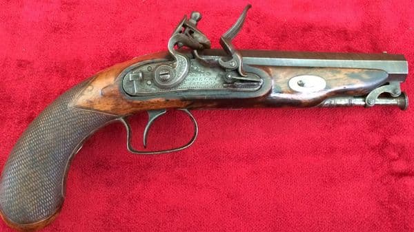 X  X X SOLD X  X X A scarce Napoleonic era Flintlock Pistol by Woolley of Bristol. Octagonal barrel,
