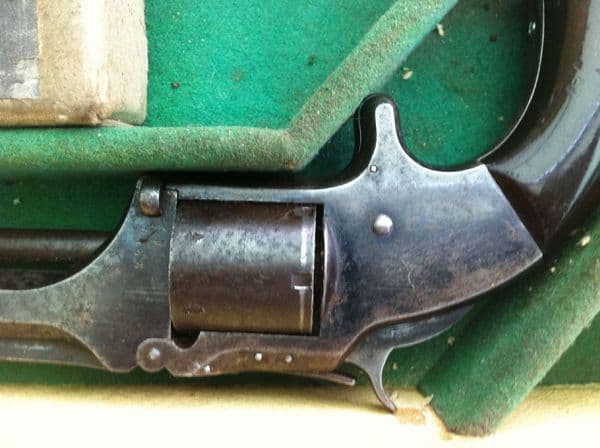 X X X  SOLD X X X   A Smith & Wesson rIimfire revolver in leather case. Ref 5817.
