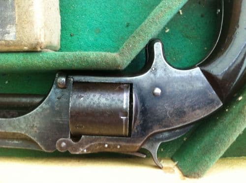 X X X SOLD X X X A Smith & Wesson rIimfire revolver in leather case. Ref 5817.