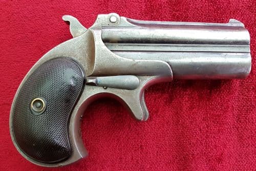 X X X SOLD X X  X An antique over & under Remington Double barrelled .41 cal rim-fire Derringer.