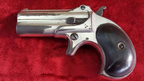 X X X SOLD X X X An antique Remington .41 rimfire double barrelled over and under gamblers