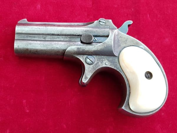 X X X  SOLD  X X X Remington .41 rim-fire Derringer pistol with Mother-of-pearl grips.  Ref 1921.