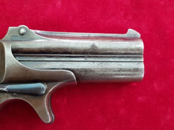 X X X  SOLD  X X X Remington .41 rim-fire Derringer pistol with Mother-of-pearl grips.  Ref 1921.