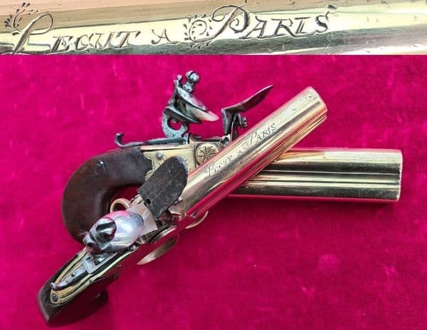 X X X SOLD X X XPair of French ove/ Under double barrel brass tap action flintlock pistols. Ref 3484