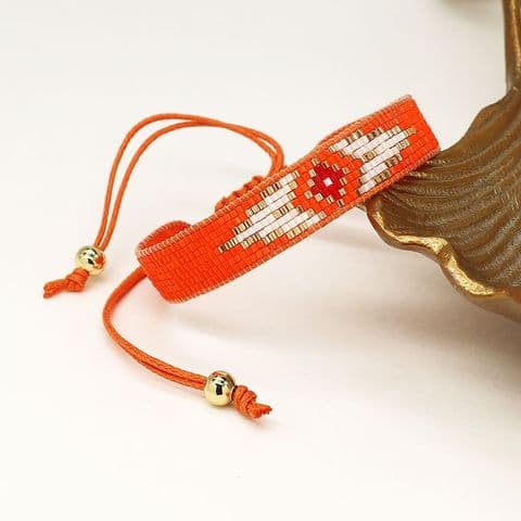 BRIGHT ORANGE 'EVIL EYE' HANDLOOMED BEADED RIBBON BRACELET