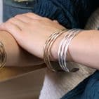 GOLDEN WORN HAMMERED TRIPLE STRAND BANGLE