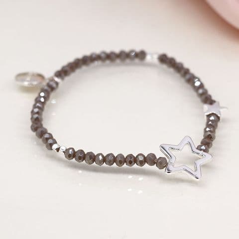 GREY BEAD BRACELET WITH SILVER PLATED SOLID AND OPEN STARS
