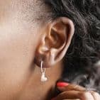 SILVER FALLING HEART CHARM HOOP EARRINGS