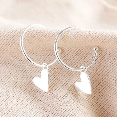 SILVER FALLING HEART CHARM HOOP EARRINGS