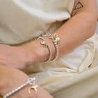 SILVER PLATED BEAD GOLDEN CLAM AND COWRIE SHELL CHARM BRACELET