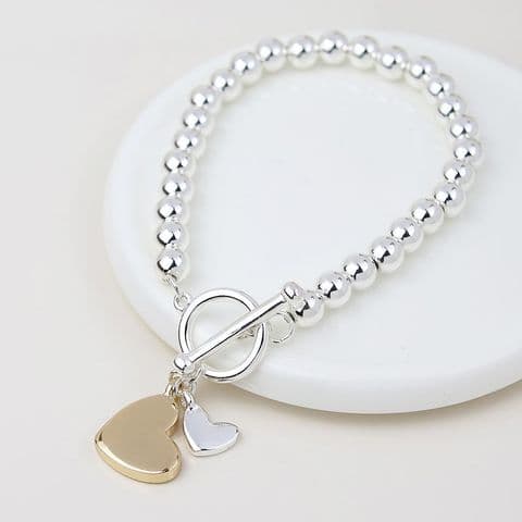 SILVER PLATED STRETCH BEADED AND DOUBLE HEARTS CHARM BRACELET