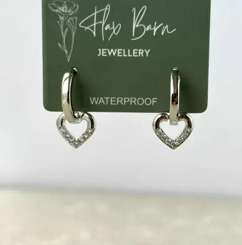 TARNISH RESISTANT HEART ZIRCONIA HUGGIE EARRINGS IN SILVER