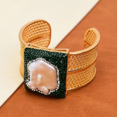Gold tone Green crystal pearl bangle