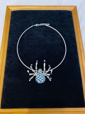Spider crafted cord necklace