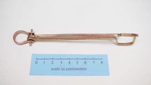 anglo saxon bronze latch lifters on a bronze suspension bar