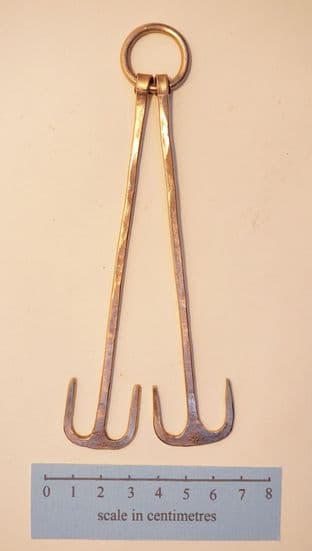 Anglo-Saxon forged bronze bifurcate latch lifters or girdle hangers on a bronze ring