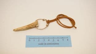 antler tine pendant with bronze wirework ring and woven cotton cordage