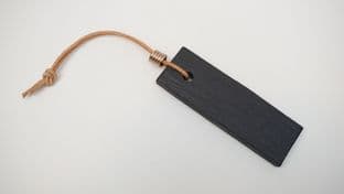 black slate honing stone with leather thonging and bronze ferrule