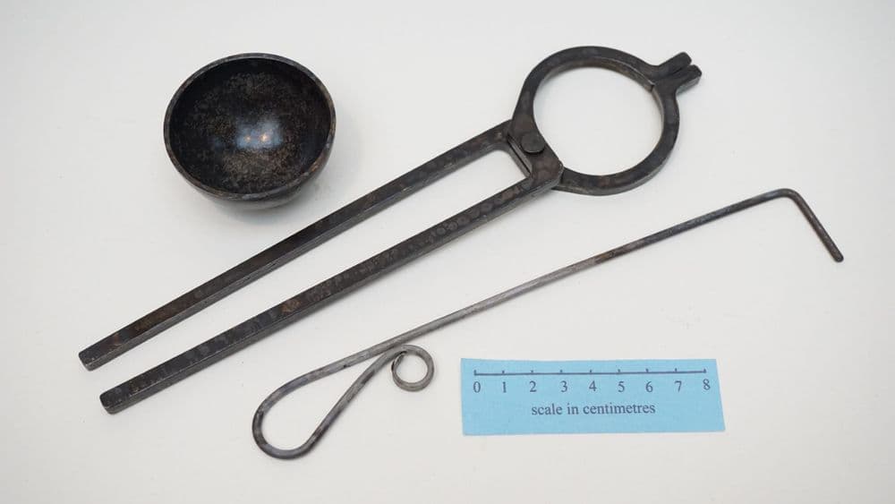 medieval alchemists cupellation dish hook and tongs