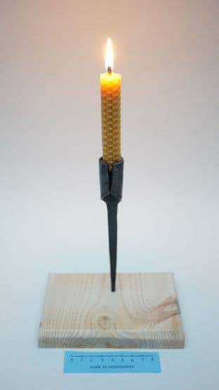 medieval forged steel candle holder stand and beeswax candle