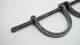 medieval slave or prisoner hand shackles on a cross bar