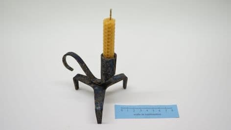 medieval style forged steel tripod candle holder and beeswax candle