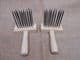 reenactment weaving pair of hand forged black steel wool combs