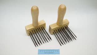 reenactment weaving pair of hand forged black steel wool combs