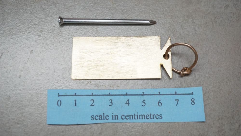 Signaculum Roman brass rectangular signaculum or baggage label with dot stamping punch