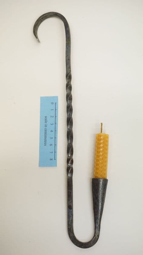 Roman hooked candle holder from silchester UK and beeswax candle