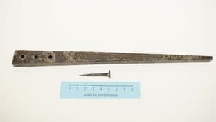 roman to medieval nail iron header with three tapered holes and one nail