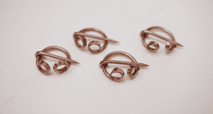 set of four 12mm diameter penannular brooches in bronze canterbury find