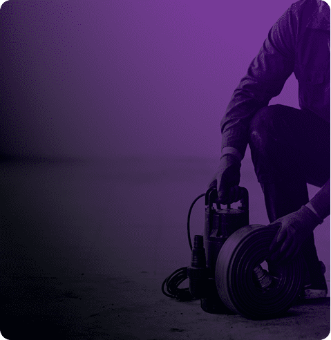 Worker handling a pump