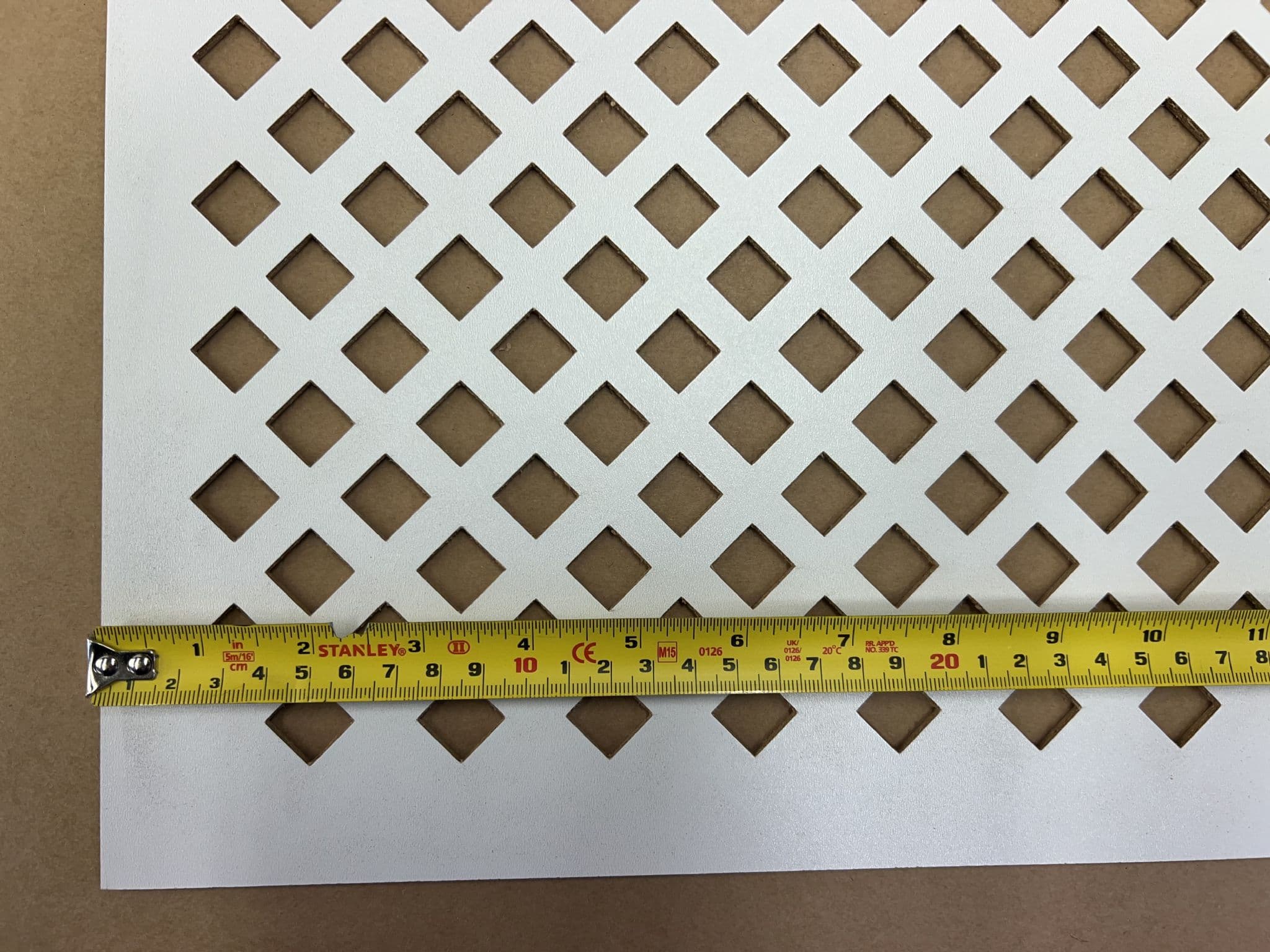 Manilla large diamond white faced perforated MDF screening panel