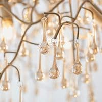 Aged gold branch linear chandelier with glass droplets FOE104242