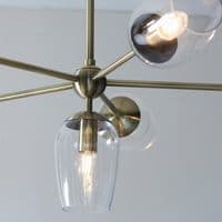 Bright nickel 6 light pendant with clear glass and adjustable stem