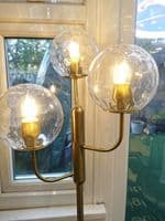 Lnox 3 Light Floor Lamp in Brushed Brass, Clear Glass Balls