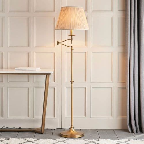 Stanford Antique Bass swing arm floor light finished in Antique Brass  beige shade