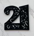 Number with cut out cake charm