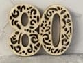Number with cut out cake charm