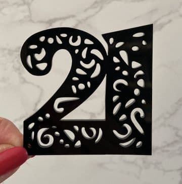 Number with cut out cake charm