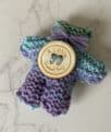 Pocket hug knitted teddy bear