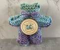 Pocket hug knitted teddy bear