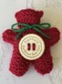Pocket hug knitted teddy bear