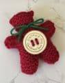 Pocket hug knitted teddy bear