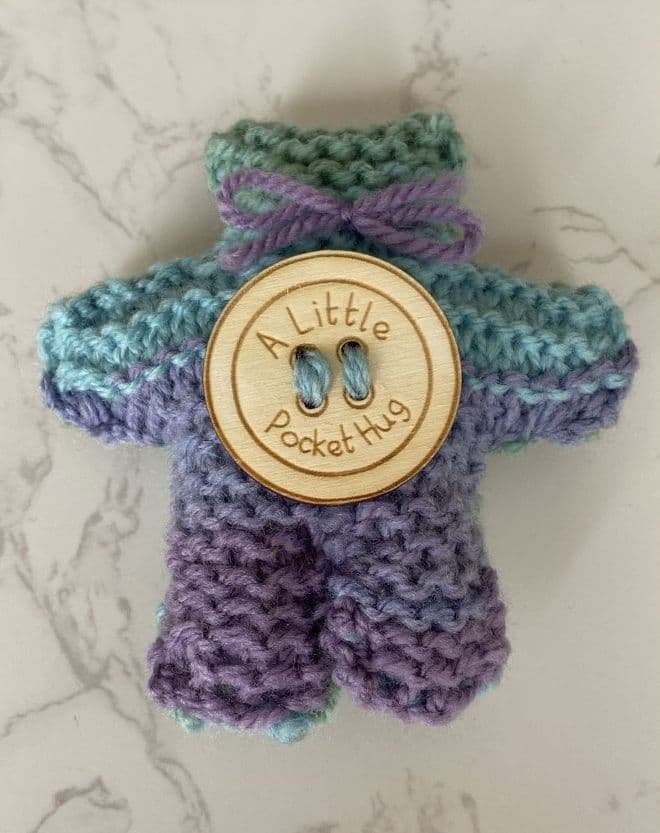 Pocket hug knitted teddy bear