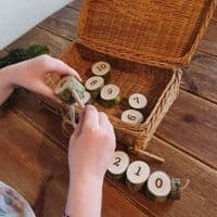 Woodburned Numbers Threading with Needle